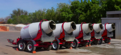 Portable concrete mixer with splash guard installed